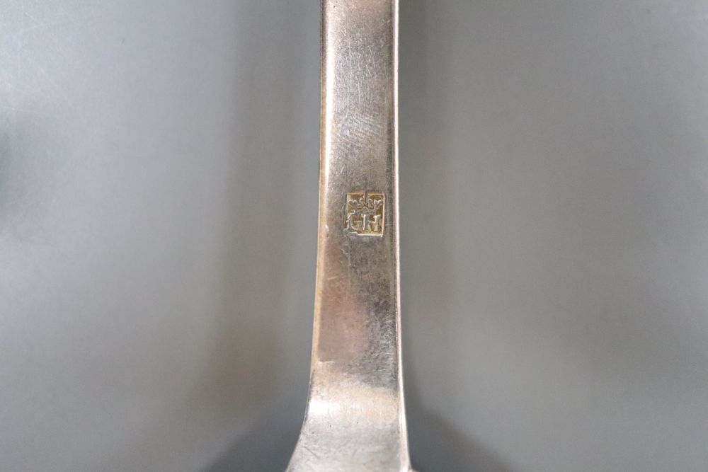 An 18th century Guernsey silver dog-nose spoon, makers mark only for Henry Guillaume, with engraved initials, 18.2cm, 27 grams.